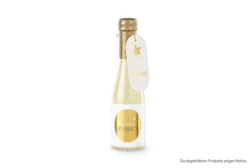 Prickelnder Sekt-Gruß mit der Aufschrift "Schöne Weihnachten"